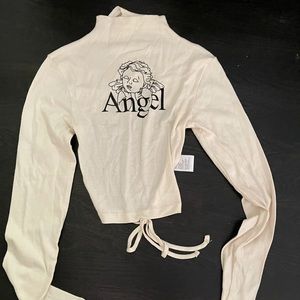 Angel long sleeve high neck cutout on the back.
